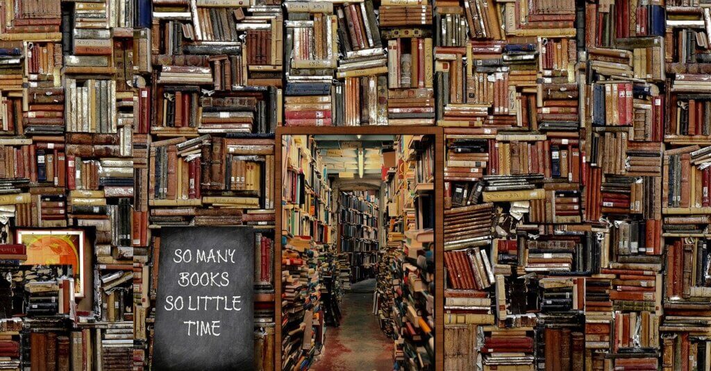 a black board with the words so many books, so little time against a library background with a multitude of books