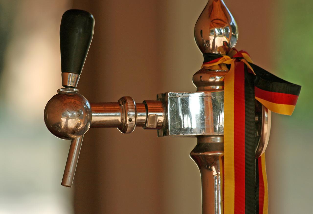 Beer tap with German flag colored ribbon tied around it